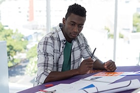 atlantic technical college student at drafting table