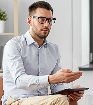 male mental health professional consulting with a patient