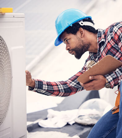 Air Conditioning technician repairing a AC unit